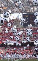 Children fly giant soccer balls